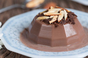 chocolate pudding topping of chocolate and almond sliced.