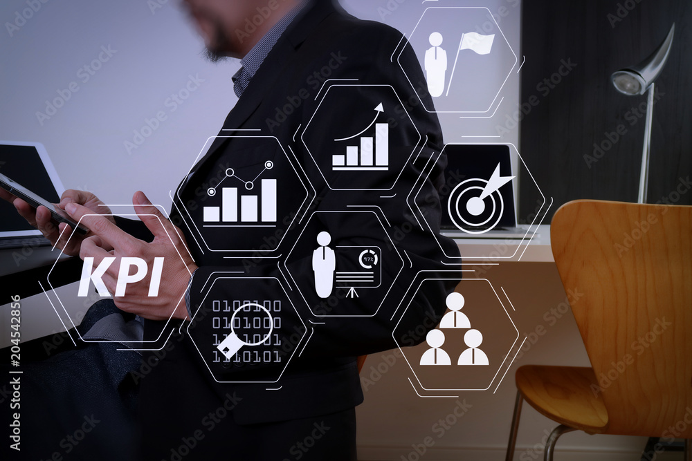 Poster businessman working with smart phone and digital tablet and laptop computer in modern office