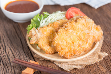 Crispy fried pork cutlet with sauce.