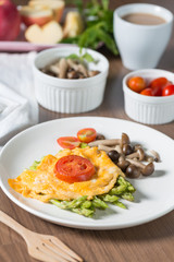 Grilled asparagus with omelette and grill tomato, stir fry shimeji mushroom.