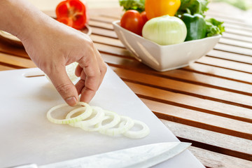 Chef preparing vegetable for cooking.