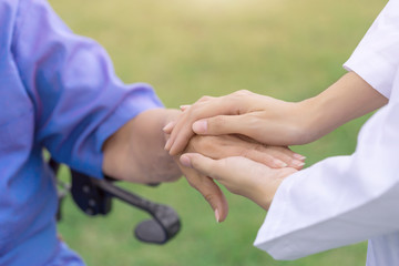 Taking care of the elderly people, nurse comforting patient.