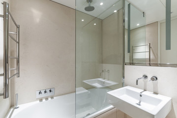 Fototapeta na wymiar light bathroom with sandstone tiles