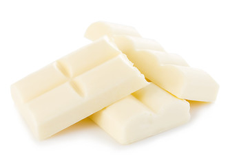 White chocolate pieces close-up isolated on a white background.
