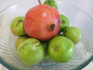 Bowl with apples and pomegranate