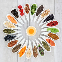 Health food wheel with ingredients to improve brain power. Super foods concept high in minerals, vitamins, antioxidants, omega 3 and anthocyanins. 