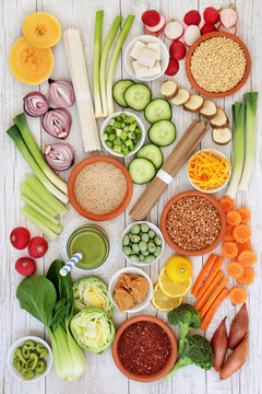 Japanese macrobiotic diet food background including cold matcha tea, wasabi paste, grains, udon and soba noodles and miso paste with foods high in antioxidants, fibre, vitamins and minerals.