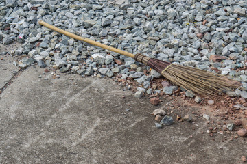 Cement surface floor and wooden broom., texture background.