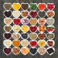 Food to promote heart health with fresh fish, vegetables, fruit, seeds, nuts, cereals, grains, herbs and spices. High in omega 3 fatty acids, antioxidants, smart carbohydrates, fibre and vitamins.