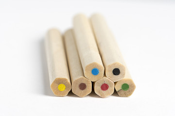 colored wall of wood with colored pencils