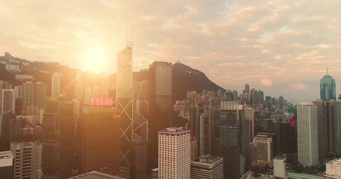 AERIAL. Hight speed flight between buildings at Hong Kong city.