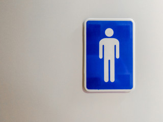 Male toilet sign on wooden door. with copy space for text.