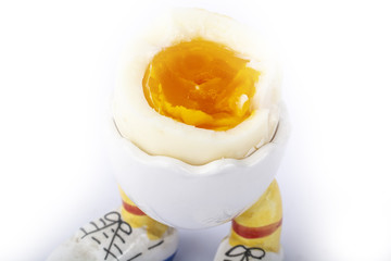 boiled egg open half with legs isolate