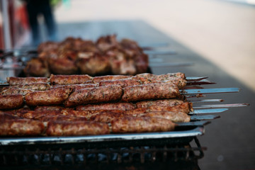 sausages on skewers. picnic on the street.
