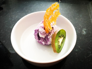 ice cream dessert with sugar crown and kiwi