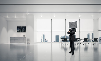 Fototapeta premium Businessman with TV instead of head.