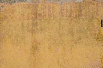 vintage wall background - old wall plaster texture, yellow, brown
