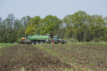 The manure is introduced into the field with a two-slice injection. Gütersloh, North...