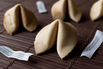 Chinese Fortune Cookies on Bamboo Mat with Chopsticks and Paper