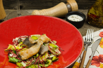 Fried trout steak with fresh vegetables salad. Fresh salad with fish. Concept healthy food. 