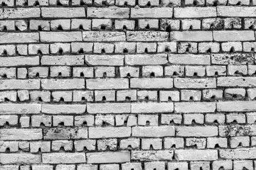 Fototapeta premium Black and white texture old brick, rustic wall in light gray and white horizontal masonry.