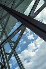 The glass architecture in city against a sky