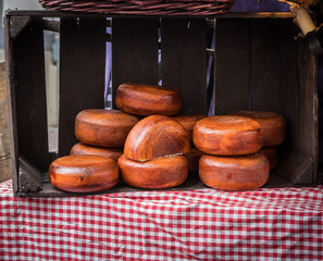 Cheese on a counter at  the market.