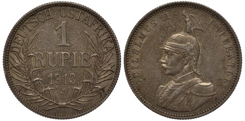 German East Africa coin one rupee 1913, denomination at center, plant branches at sides, bust of Emperor Wilhelm II, eagle sitting on helmet, silver,