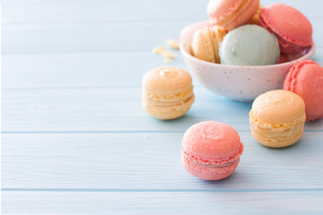 Assortment of macarons on blue wood background