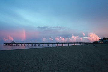 North Side of Deerfield Beach, Florida Pier under Blue Sky with Red Clouds After Dusk in Twilight