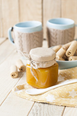 Apple jam, biscuits and coffee with milk for breakfast