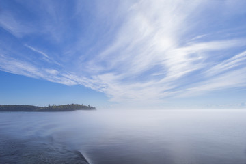 Panorama of the island of Valaam. Morning mist over Lake Ladoga.