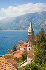 Beautiful Metiterranean landscape. Montenegro, Bay of Kotor. View of ancient town of Perast with  bell tower of Church of Our Lady of Rosary. Travel and tourism concept