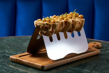 Baked peas in bread cakes on cutting board. Luxury delicious vegetarian healthy food, close-up