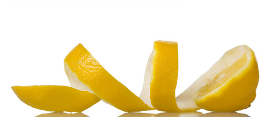 Lemon slice with peel isolated on white. Closeup