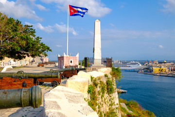 Cannons on an old colonial fortress and a view of Havana