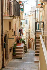 Italy, Foggia, Apulia, SE Italy, Gargano National Park, Vieste. Old city, residential homes along pedestrian streets. Laundry drying.