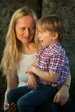 Mother looks at her son who is crying