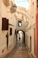 Italy, SE Italy, Ostuni. Narrow, arched old town . Red. Doorways.The 