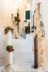 Fototapeta na wymiar Italy, SE Italy, Ostuni. Narrow, arched old town . DoorsBlue Doorways.The 