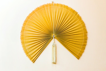Decorative vietnamese fan on the wall in Hanoi, Vietnam. Close-up.