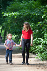 Fototapeta premium Brothers taking a walk in a park 