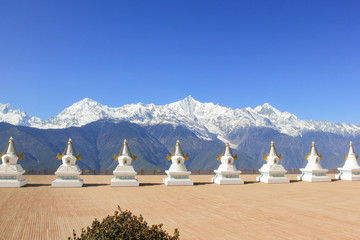 Holy white stupas by Feilai Temple overlooking the Meili Snow Mountain in Deqin, Yunnan province,...