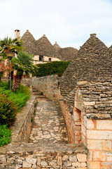 Fototapeta na wymiar Italy, SE Italy, Region of Apulia, Province of Bari, Itria Valley, Alberobello. A trullo house is a Apulian dry stone hut with a conical roof. UNESCO Heritage site.