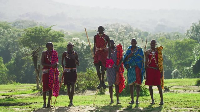 Maasai men jumping one at a time