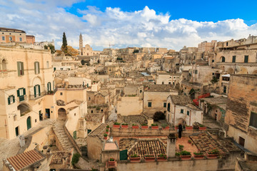 Naklejka premium Italy, Southern Italy, Region of Basilicata, Province of Matera, Matera. The town lies in a small canyon carved out by the Gravina. Overview of town.