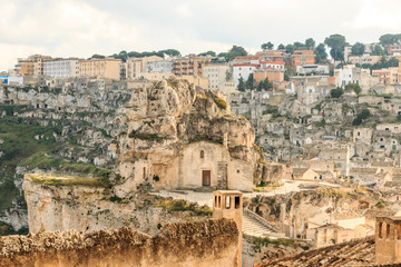 Fototapeta na wymiar Italy, Southern Italy, Region of Basilicata, Province of Matera, Matera. The town lies in a small canyon carved out by the Gravina. Overview of town.