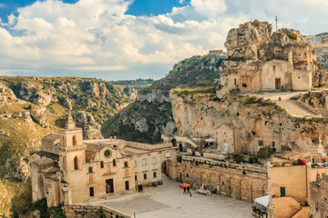 Italy, Southern Italy, Region of Basilicata, Province of Matera, Matera. The town lies in a small canyon carved out by the Gravina. - obrazy, fototapety, plakaty