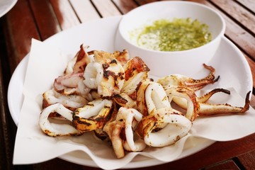 close up hot squid grilled on table