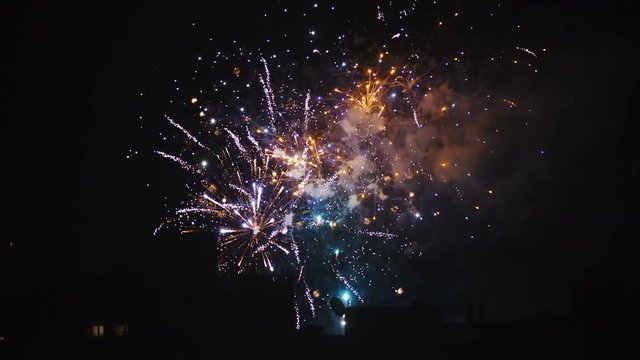 Colorful fireworks explosion at night in slow motion 4K